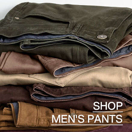 Stack of men's pants in various neutral and earthy tones, including olive, brown, tan, and khaki. Text reads &ldquo;Shop Men's Pants.&rdquo;